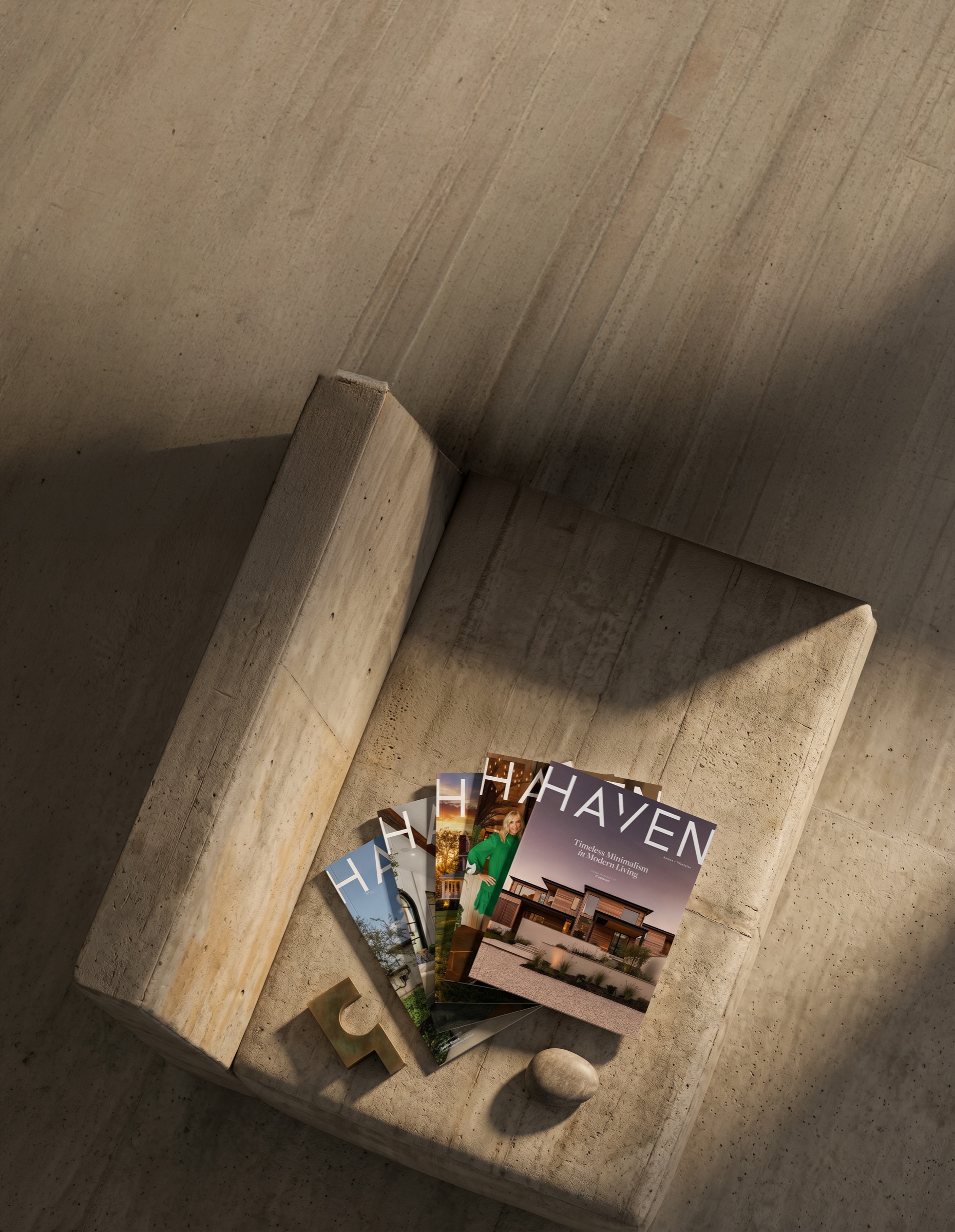 HAVEN magazines styled on a sunlit stone table